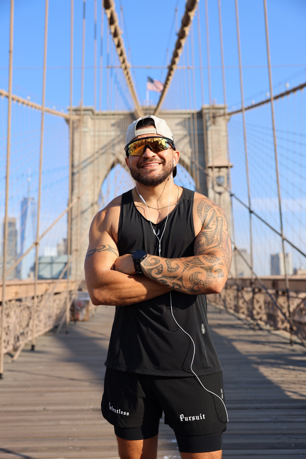 Andrew running on the Brooklyn Bridge at sunrise
